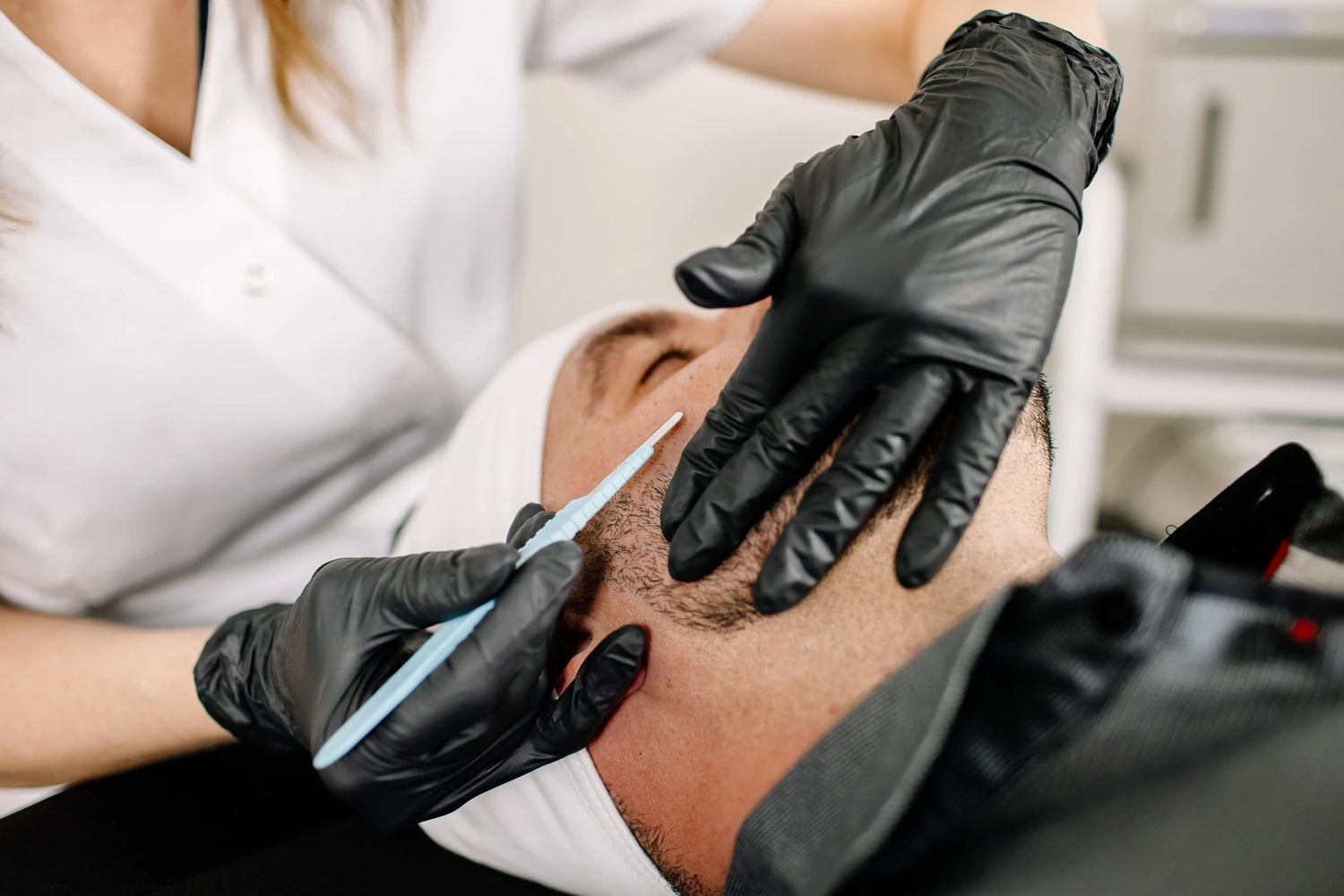 Man Receiving Dermaplaning Treatment