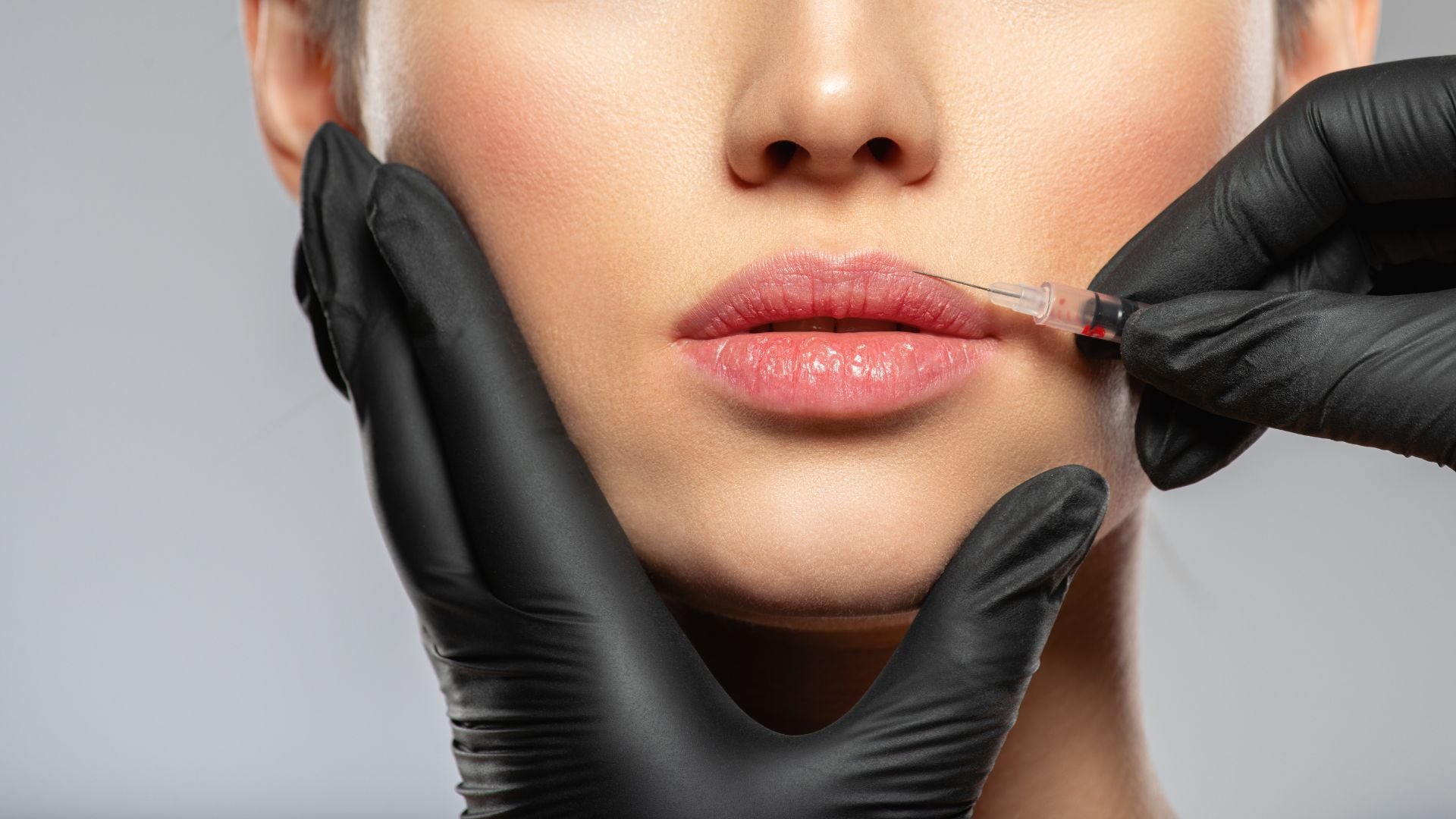 Woman receiving cosmetic injectables