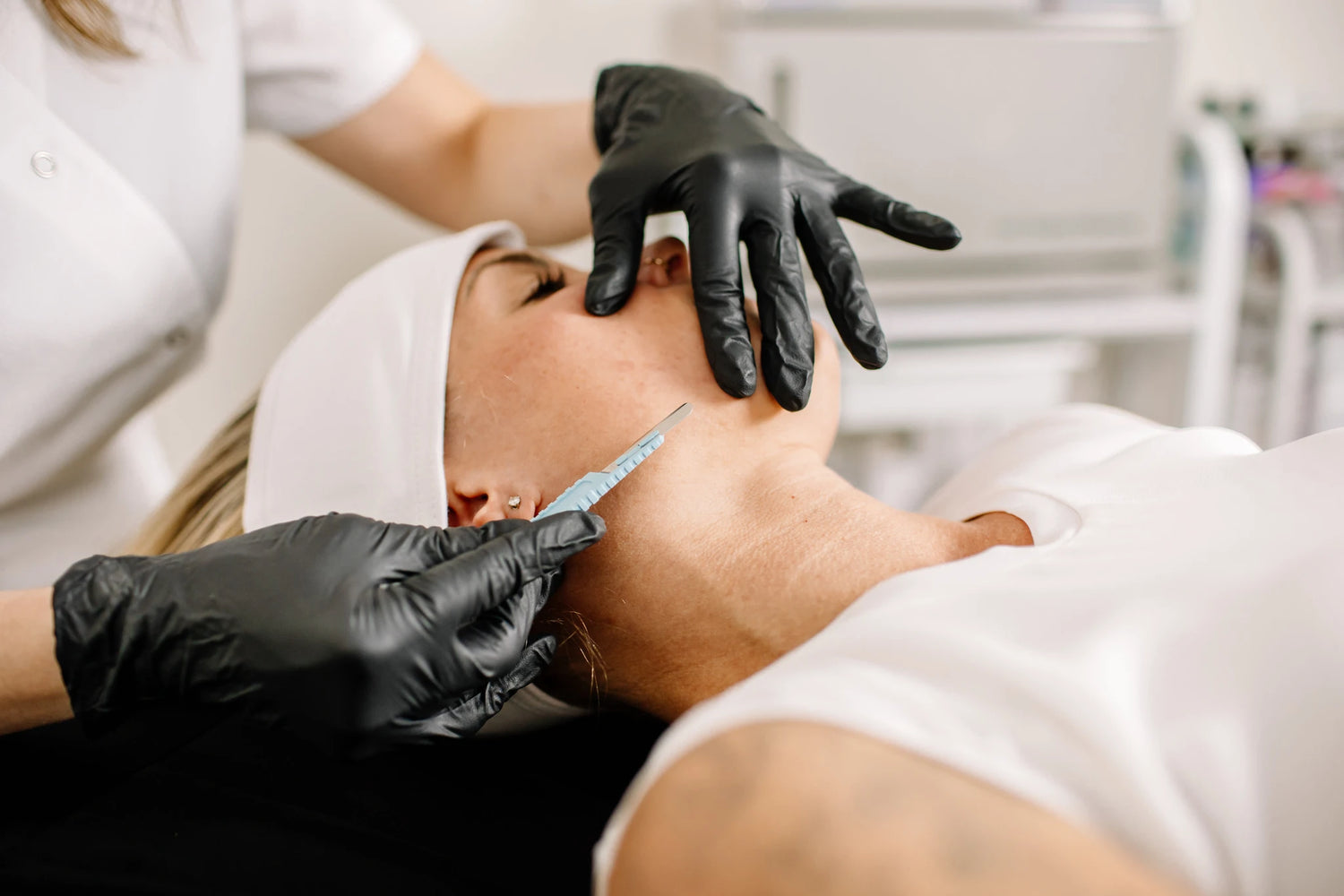 Woman receiving treatment for dry skin