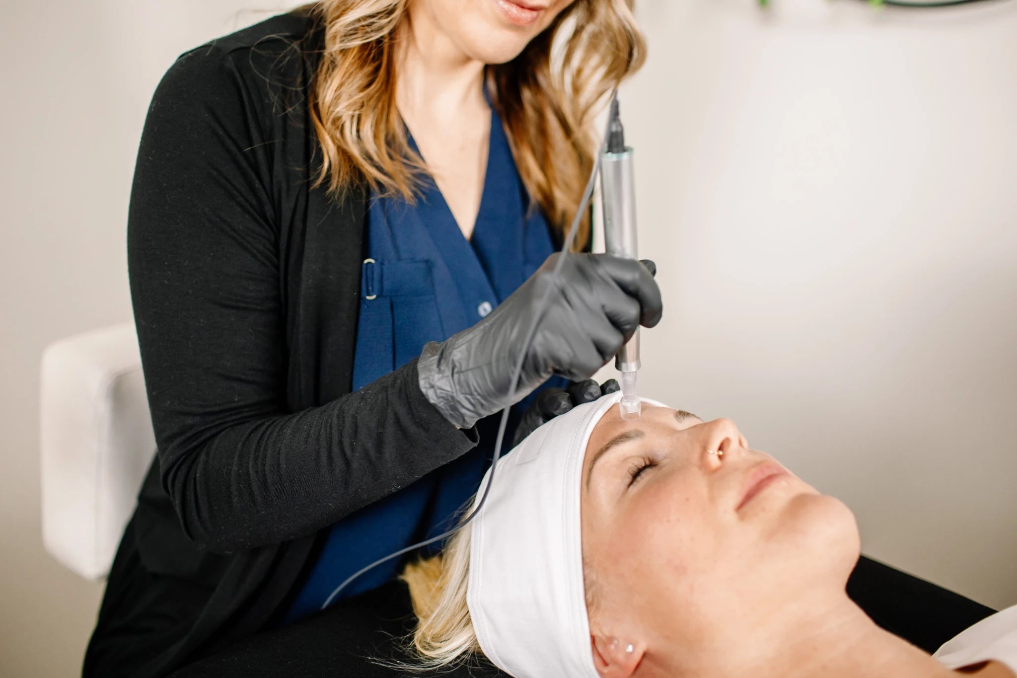 Woman receiving treatment for dull complexion