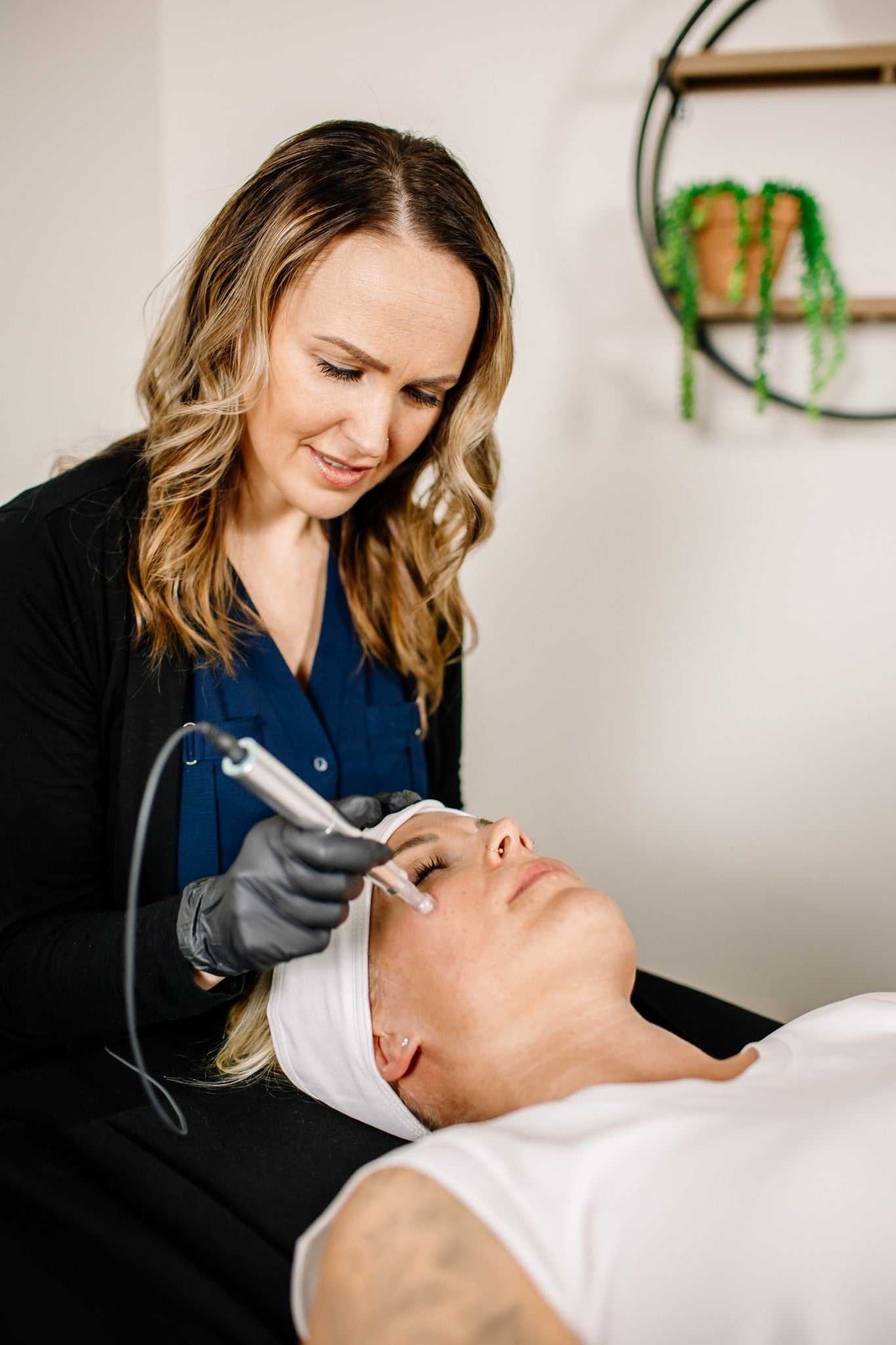 Woman receiving microneedling treatment