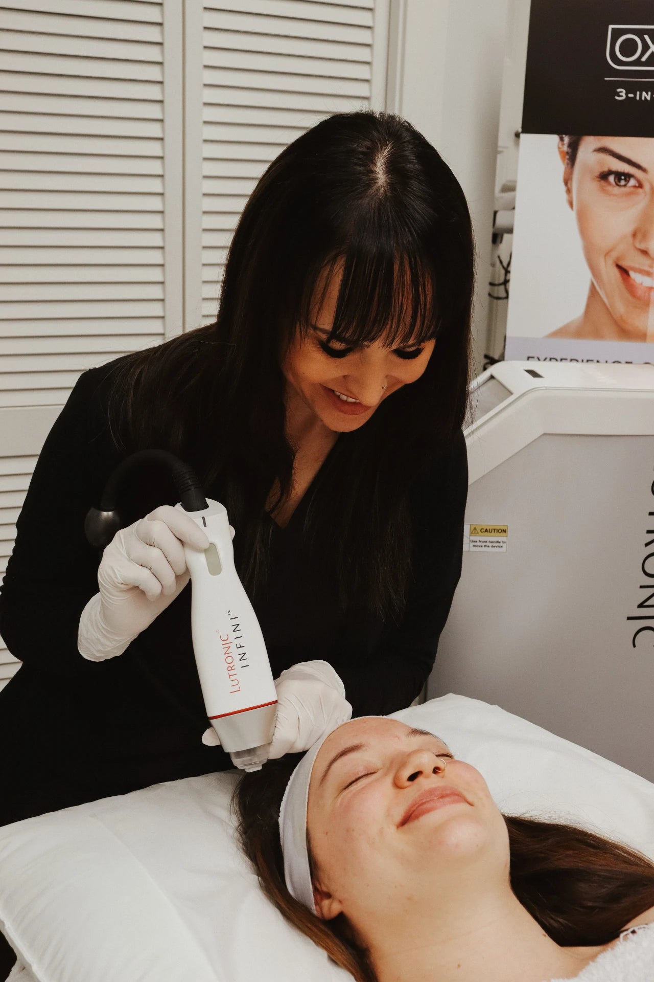 Woman receiving RF microneedling treatment